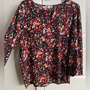 Floral blouse with triangle cut out